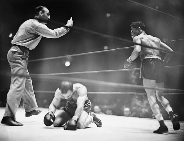 Boxer Kneeling on Canvas After Knock Out