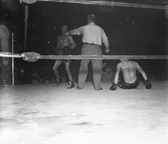 Lou Ambers on the Turf in Boxing Action with Henry